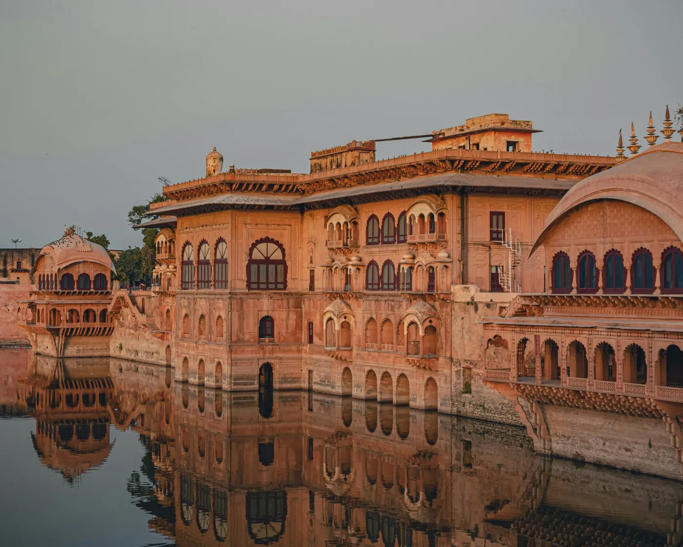 Rajasthani palace beside a lake at sunset